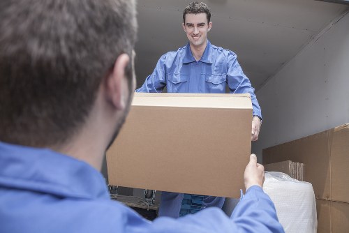 Furniture pick-up service removing a sofa in Bow