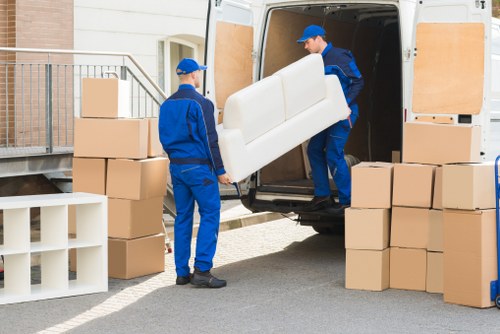 Professional packing and unpacking services in Bow with labeled moving boxes