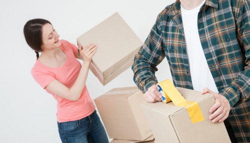 Removal team preparing boxes and furniture safely during a house move