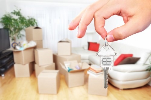 A removals team handling household items during a Bow moving project