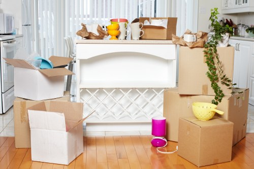 Preparation checklist and boxed belongings ready for a flat removal in Bow
