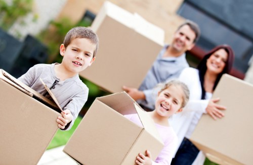 Packed office boxes and labeled furniture ready for commercial relocation