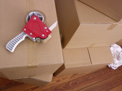 Bow man and van service loading furniture into a van