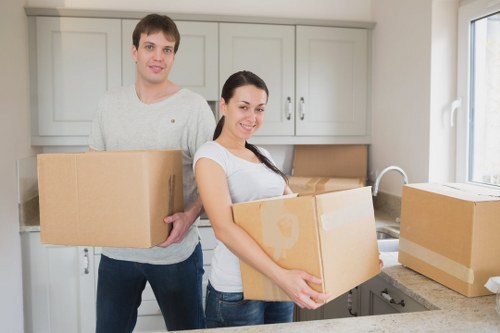 Packed office furniture and boxes prepared for relocation in Bow